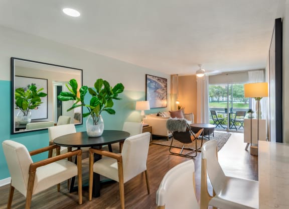 a living room and dining room with a table and chairs at The Villas at Ibis Landing, Florida, 33067