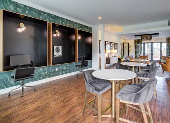 A room with a table and chairs in it.