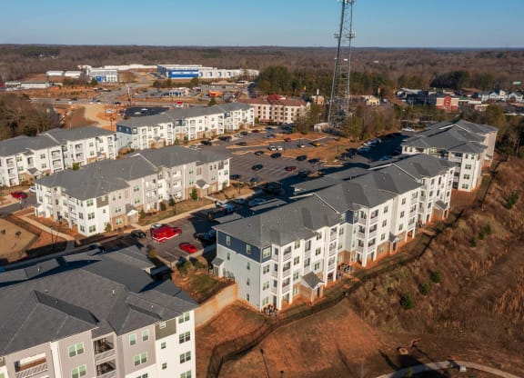 an aerial view of an apartment complex in a city at Capstone at Banks Crossing, Commerce, 30529