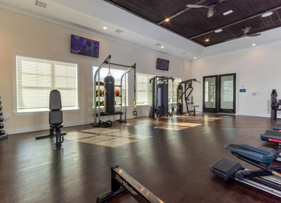the home gym has plenty of equipment and space for workouts at Capstone at Banks Crossing, Commerce, GA