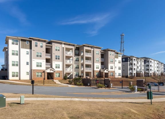 an apartment building on the corner of a street at Capstone at Banks Crossing, Commerce, GA, 30529