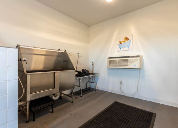 a room with a sink and a refrigerator at Capstone at Banks Crossing, Commerce