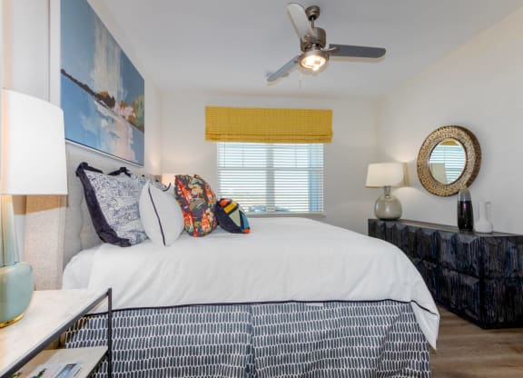 a bedroom with a large bed and a ceiling fan at Capstone at Banks Crossing, Commerce, GA