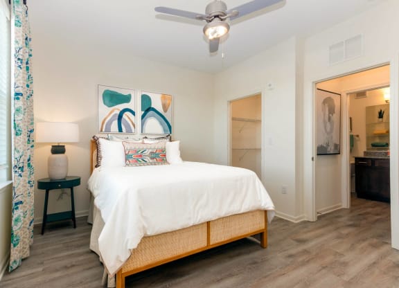 a bedroom with a bed and a ceiling fan at Capstone at Banks Crossing, Commerce, GA, 30529