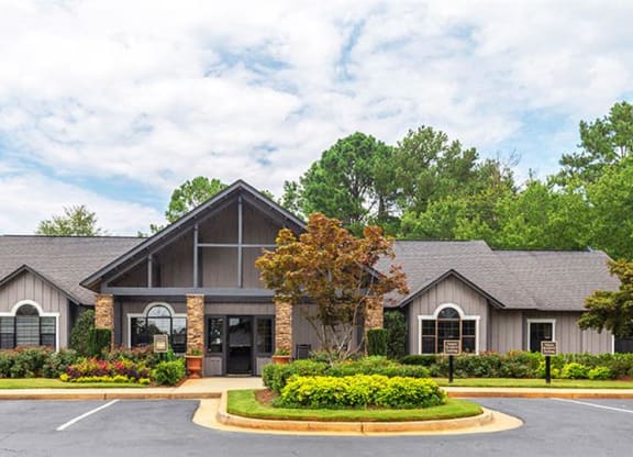 a house with a yard and a parking lot at High Ridge Apartments, Athens, GA