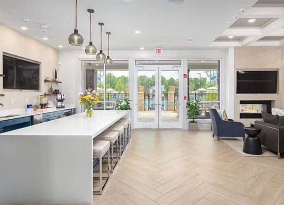 a kitchen and living room with a white counter top at Promenade at Newnan Crossing, Georgia