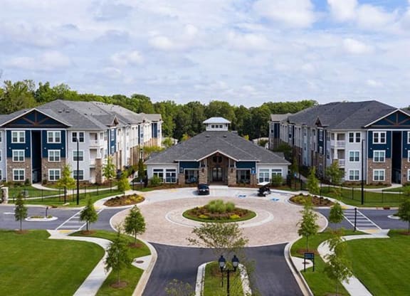 an aerial view of an apartment complex with a circular courtyard at Promenade at Newnan Crossing, Newnan, 30265