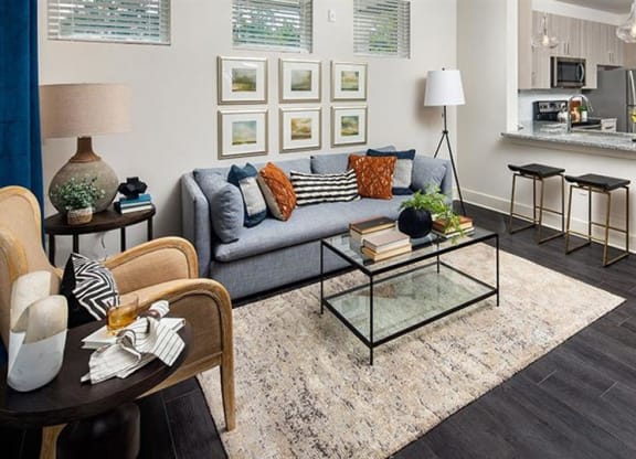 a living room with a couch and a table at Promenade at Newnan Crossing, Newnan, 30265