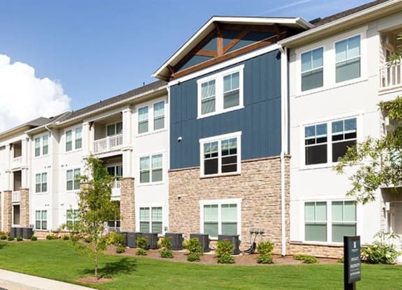 a row of apartment buildings on the side of a street at Promenade at Newnan Crossing, Newnan, GA 30265