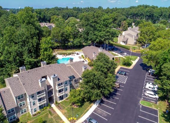 an aerial view of a large apartment complex with a swimming pool and parking lot at Hunters Chase Apartments, Midlothian, Virginia