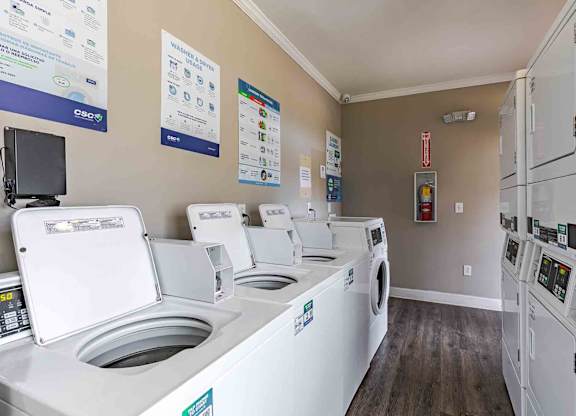A row of washing machines in a laundromat.