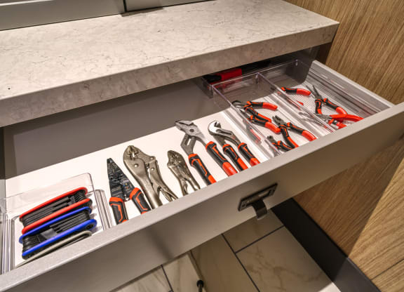 a drawer with a bunch of tools in it