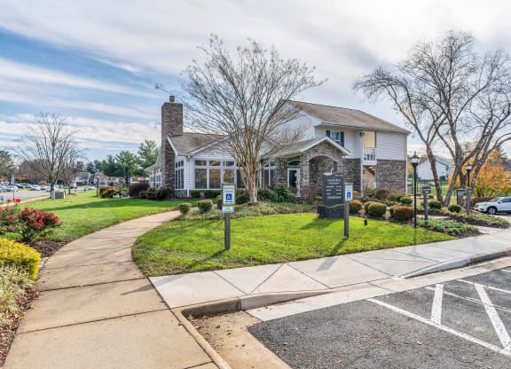 a house with a parking lot in front of it at Misty Ridge Apartments, Woodbridge, VA