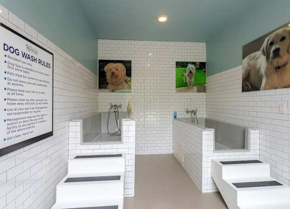 A dog wash station with a sign on the wall.