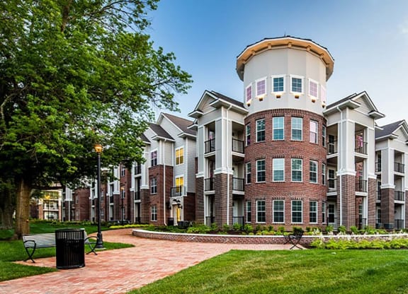 a large building with a round tower on top of it at Canopy at Ginter Park Apartments, Richmond, VA, 23227