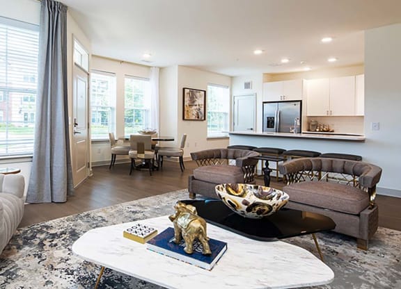 a living room filled with furniture and a large window at Canopy at Ginter Park Apartments in Richmond, Virginia 23227