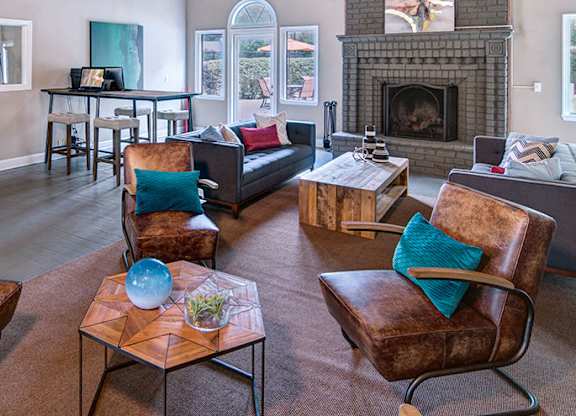 A living room with a fireplace and a couch.