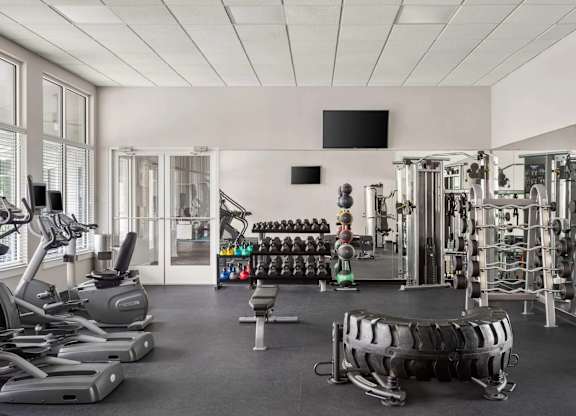 Fitness center with cardio and weight equipment at Colony at Centerpointe Apartments, Virginia