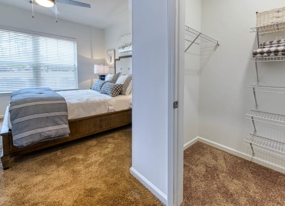 a bedroom with a bed and a closet and a window at Retreat at Arden Farms, North Carolina, 28704