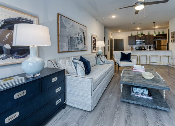 a living room filled with furniture and a table with a lamp at Retreat at Arden Farms, Arden North Carolina