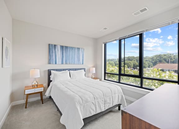 a bedroom with a bed and a large window at Rivergate, Virginia