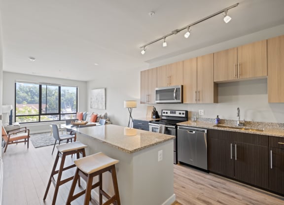 a kitchen and living room in a 555 waverly unit at Rivergate, Woodbridge, VA, 22191