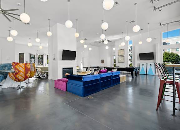 A room with a white ceiling and a blue couch.