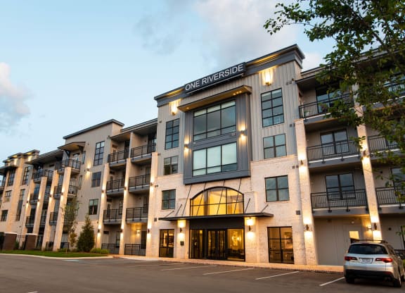 a car parked in front of an apartment building  at One Riverside Apartments, Tennessee, 37403