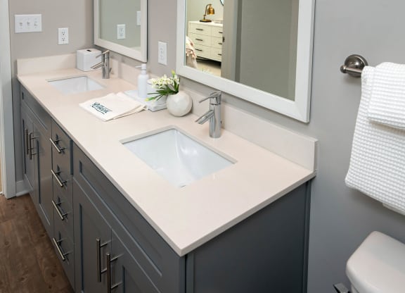 a bathroom with a sink and a mirror at One Riverside Apartments, Tennessee, 37403
