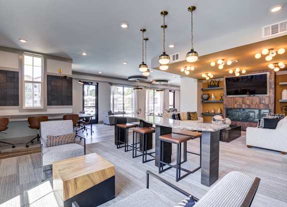 A modern open plan living and working space with a kitchen, dining and lounge area.