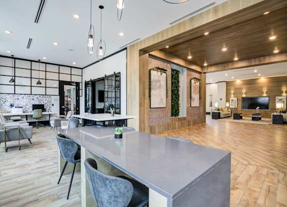 A modern kitchen with a dining table and chairs.