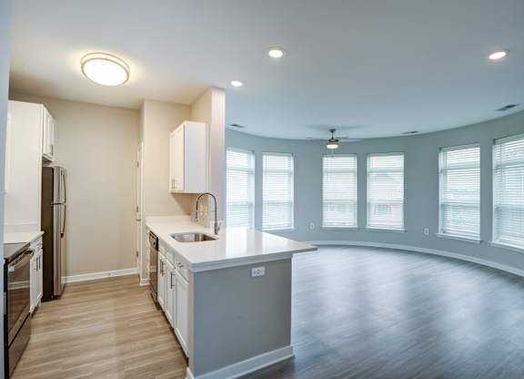A kitchen with a large island in the middle of the room.
