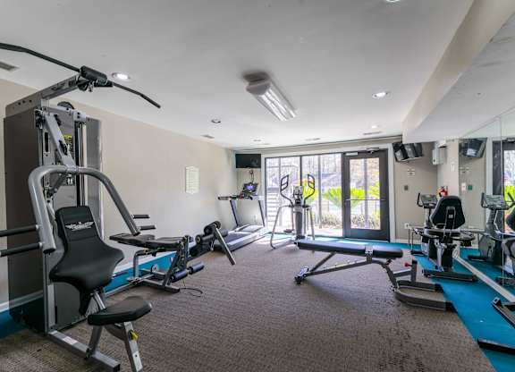 A well-equipped gym with a variety of exercise machines.
