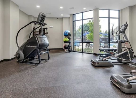 a gym with exercise equipment on the floor and a window at 17 Broad, Chattanooga, TN 37408