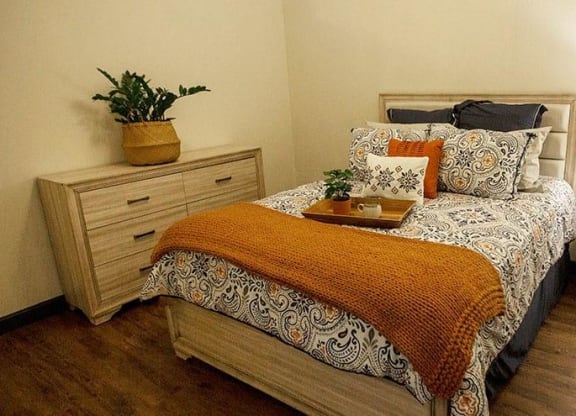 a bedroom with a bed and two night stands at 17 Broad, Chattanooga