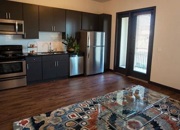 a living room with a kitchen and a coffee table at 17 Broad, Tennessee, 37408