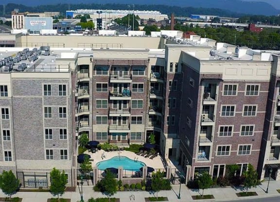 an aerial view of a large building with a swimming pool at 17 Broad, Chattanooga Tennessee