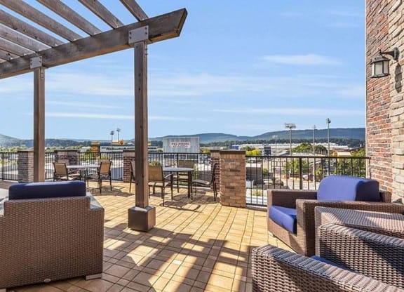 a large deck with furniture and a view of the city at 17 Broad, Chattanooga, TN