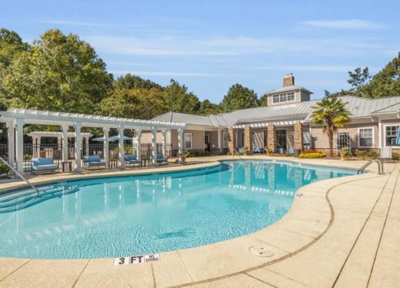 a large swimming pool with a house in the background at Marina Point, Chattanooga, 37415