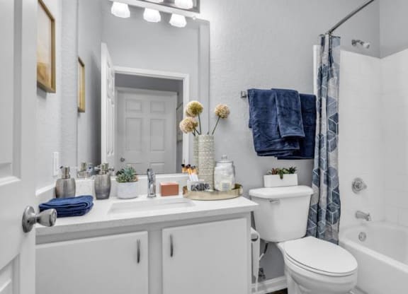 a white bathroom with a toilet sink and shower at Marina Point, Tennessee, 37415