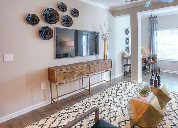 a living room with a couch and a television  at Lullwater at Big Ridge, Hixson, TN, 37343