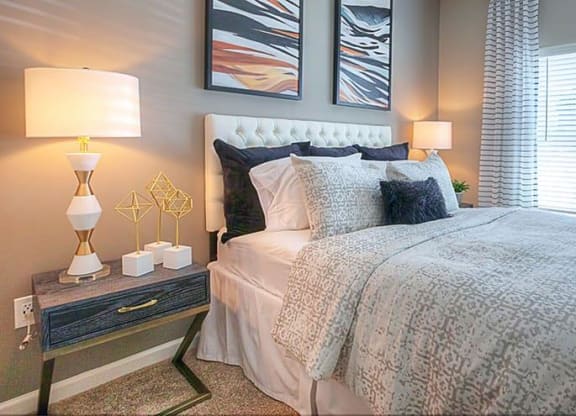 a bedroom with a bed and two lamps  at Lullwater at Big Ridge, Hixson, Tennessee