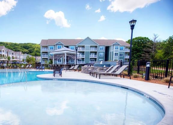 a large swimming pool with a building in the background  at Lullwater at Big Ridge, Hixson, TN, 37343
