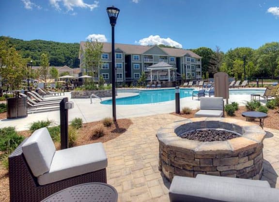 an outdoor patio with a fire pit and a swimming pool  at Lullwater at Big Ridge, Tennessee, 37343