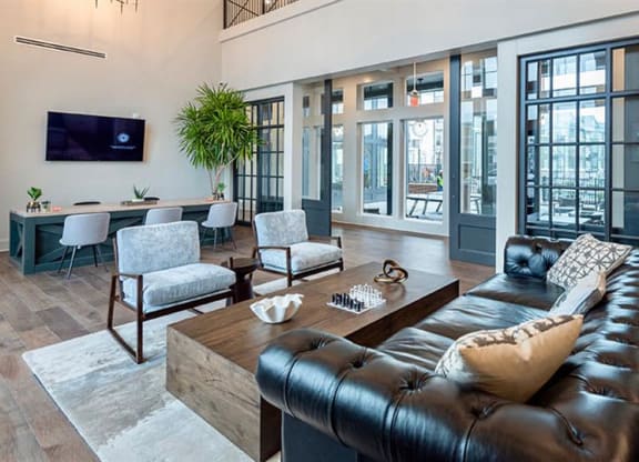 a living room filled with furniture and a flat screen tv at Livingston Flats Apartments, Chesterfield, VA