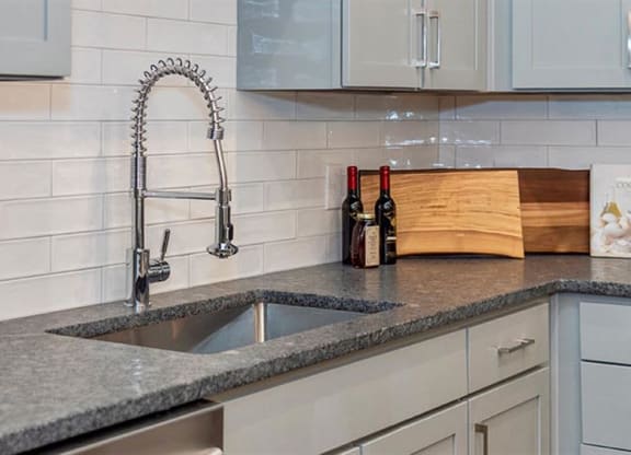 a kitchen with a sink and a faucet at Livingston Flats Apartments, Chesterfield