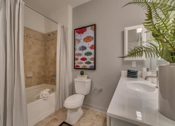a bathroom with a toilet sink and shower at Flats at West Broad Village, Glen Allen, 23060