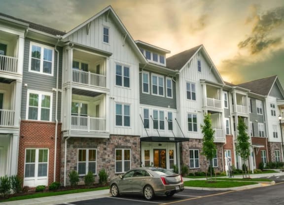 a car parked in front of a building at Artistry at Winterfield Apartments, Midlothian, Virginia