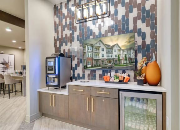 a room with a television and a counter with drinks on it at Artistry at Winterfield Apartments, Midlothian, Virginia
