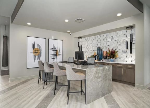 a room with a desk and chairs and a computer on it at Artistry at Winterfield Apartments, Virginia